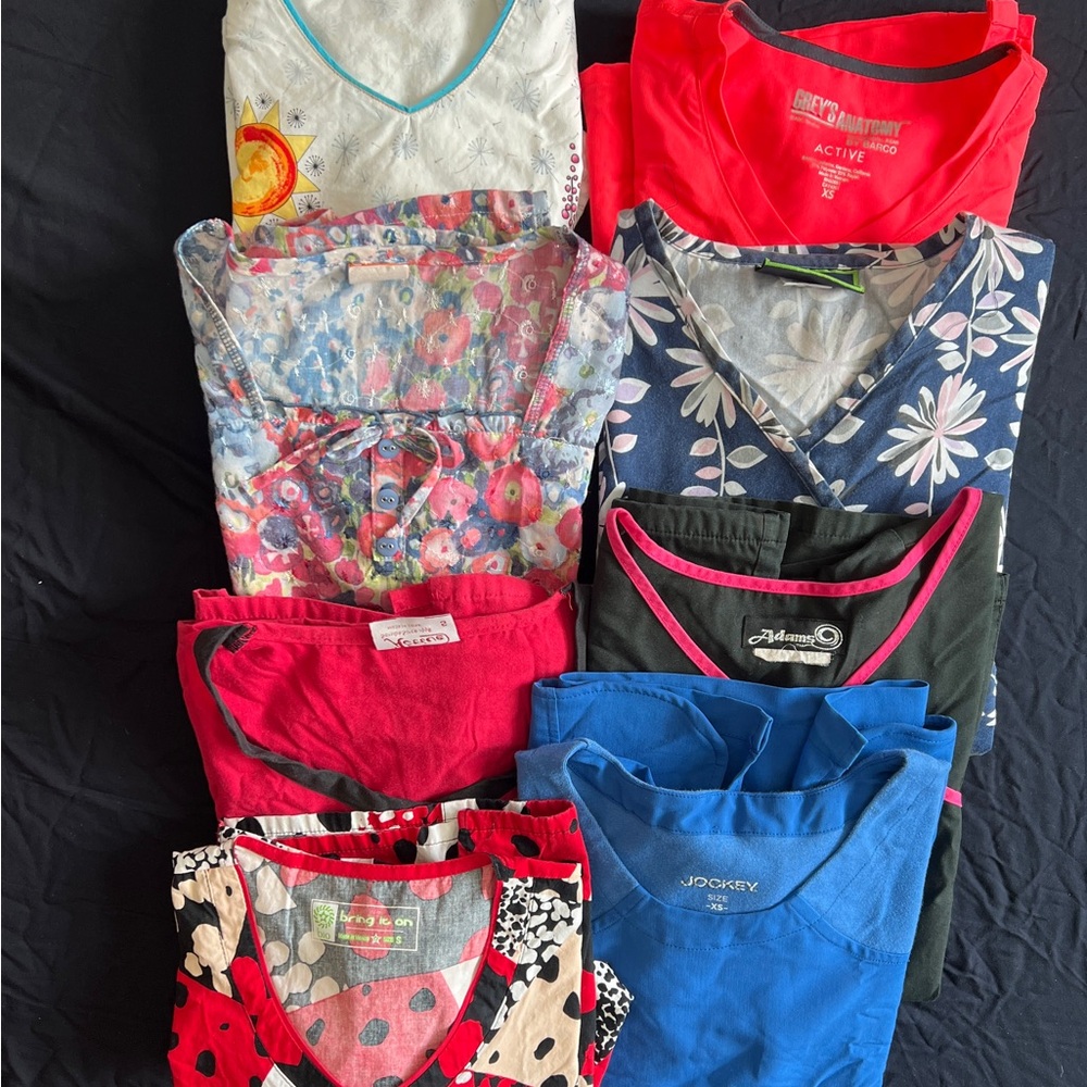 Bundle of 8 various used scrub tops size extra small and small